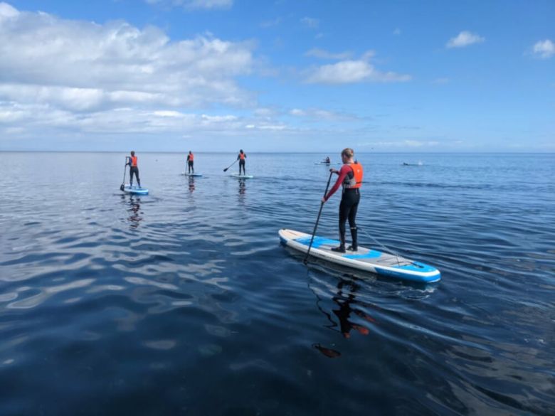 SUP boarding across the lake