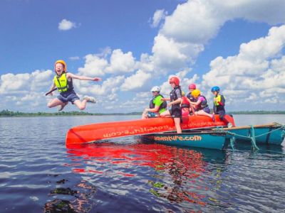 Jumping from an up-side-down canoe into the river