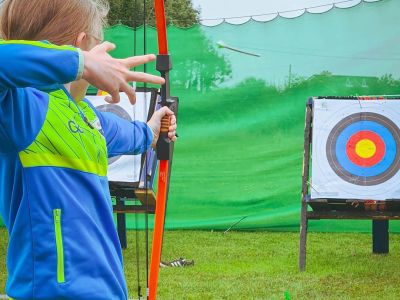 Girl taking shot at archery
