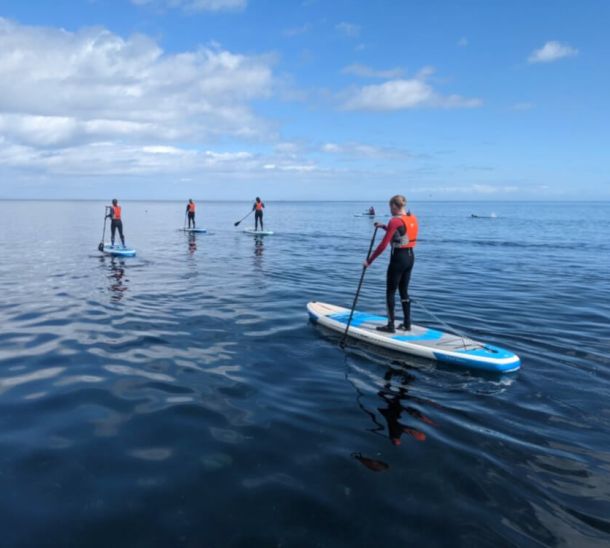 SUP boarding across the lake